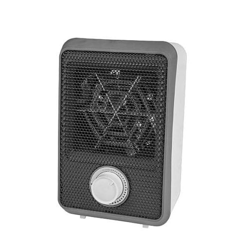 Compacte zwarte Eurom elektrische fanheater van 600 Watt met omvalbeveiliging, staand in een caravaninterieur.